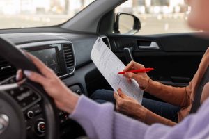 woman taking her drivers license test vehicle