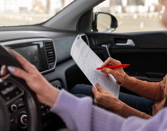 woman taking her drivers license test vehicle